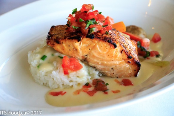 Pan Seared Salmontomato basil salsa, sticky rice and seasonal vegetables with a citrus chive cream sauceSeared beautifully, moist, tender and packed with flavour.